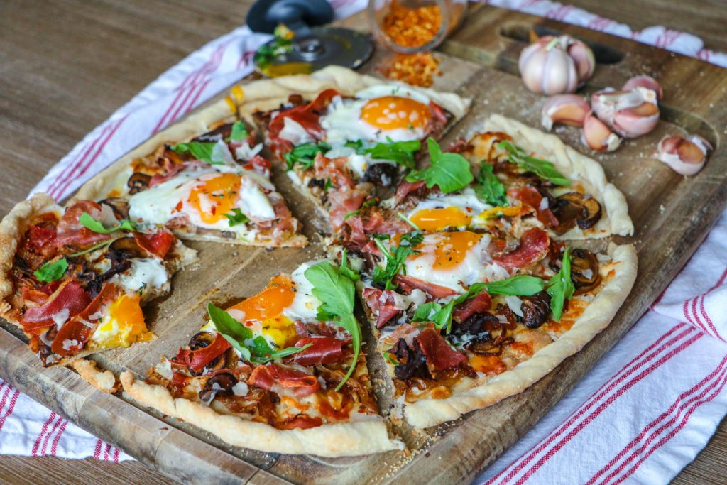 Breakfast Pizza with Prosciutto, Caramelized Onions, Mushrooms & Arugula Emi Cooks
